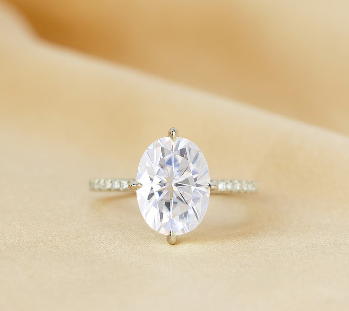 White
gold oval moissanite engagement ring