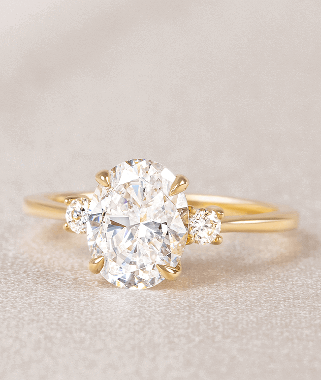 Yellow gold three stone engagement ring